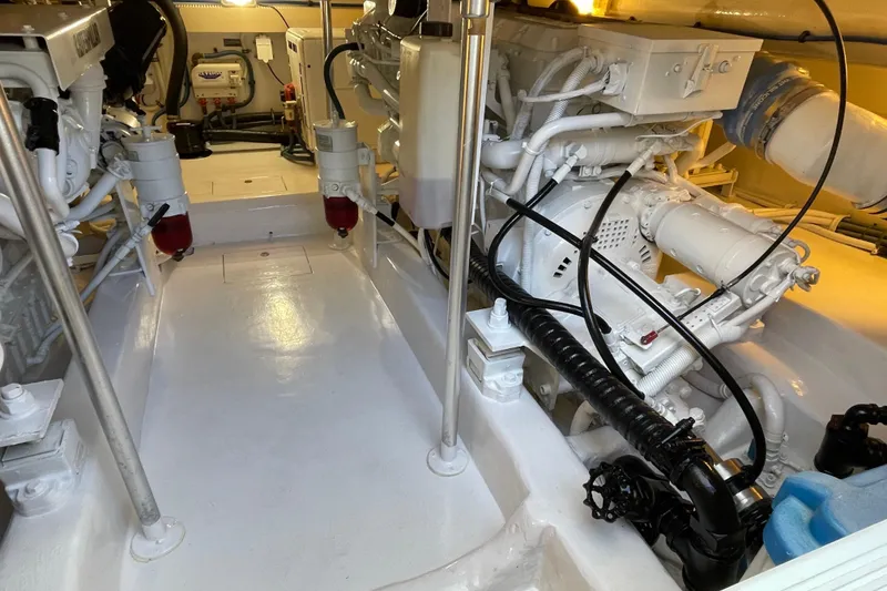 Slide: The Image of Engine room of 2003 Egg Harbor 37 Sport Fisher, showcasing clean, organized machinery. - 66