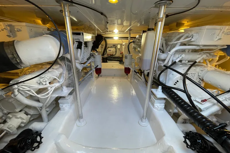 Slide: The Image of Engine room of 2003 Egg Harbor 37 Sport Fisher, showcasing clean, organized machinery. - 67
