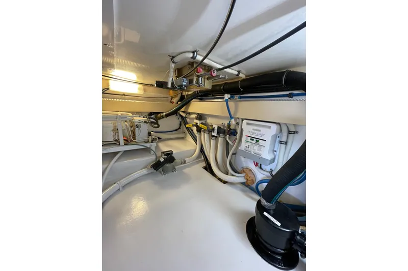 Slide: The Image of Engine room of 2003 Egg Harbor 37 Sport Fisher with visible wiring and equipment. - 68