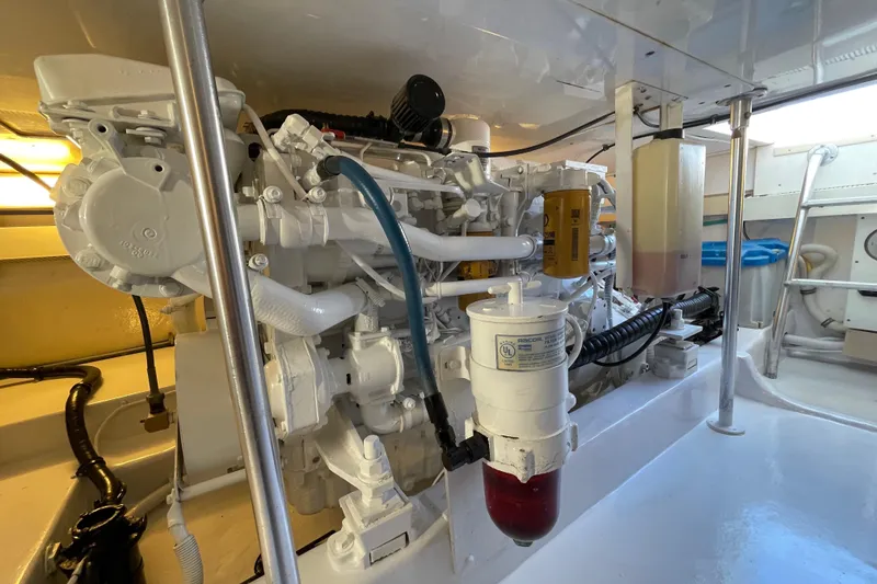 Slide: The Image of Engine room of a 2003 Egg Harbor 37 Sport Fisher, showcasing detailed machinery and components. - 69