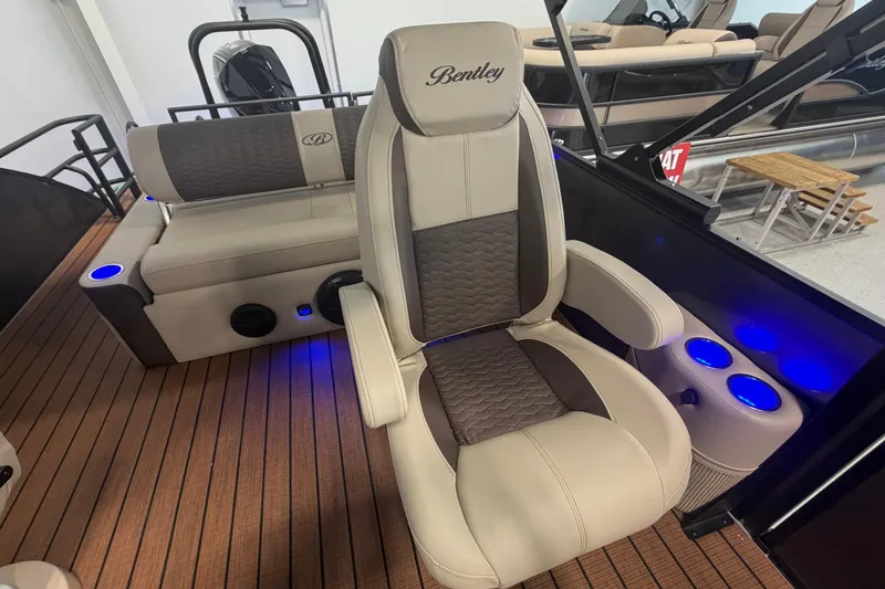 Slide: The Image of 2026 Bentley Pontoons Elite 223 Swingback interior with luxurious seating and ambient lighting. - 11