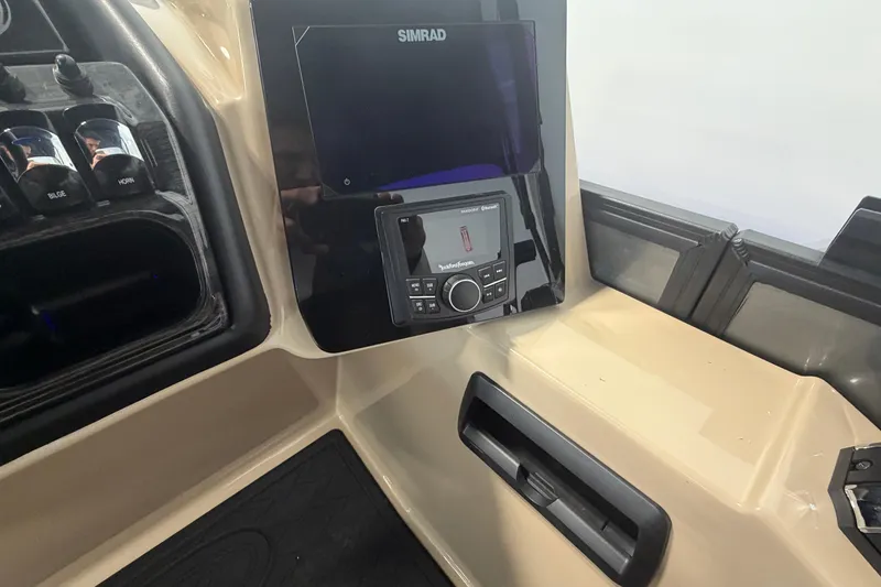 Slide: The Image of 2026 Bentley Pontoons Elite 223 Swingback dashboard with Simrad display and controls. - 15