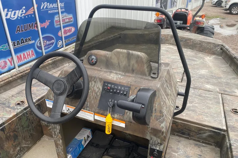 Slide: The Image of 2025 G3 Gator Tough 20 CCJ boat interior with steering wheel and control panel. - 6