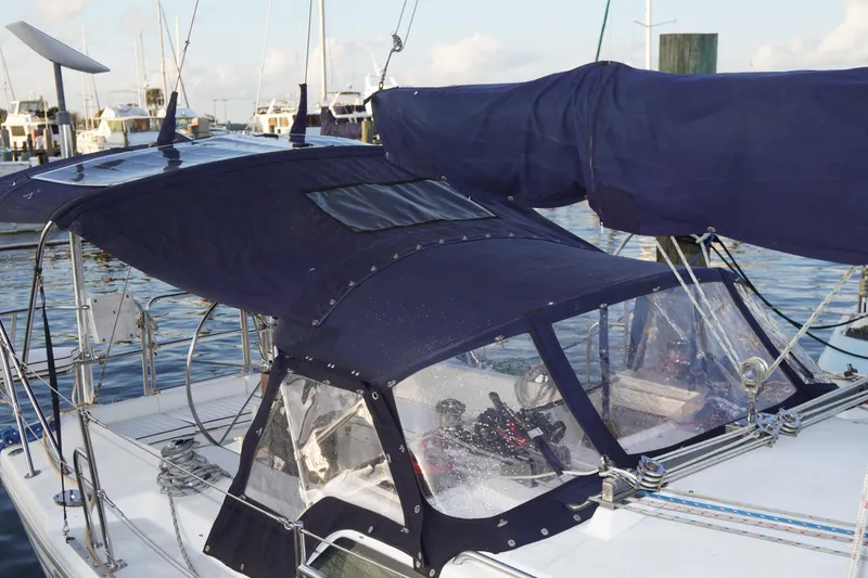 Slide: The Image of Catalina 36 MkII sailboat, 2000 model, with navy blue canvas cover in a marina. - 10