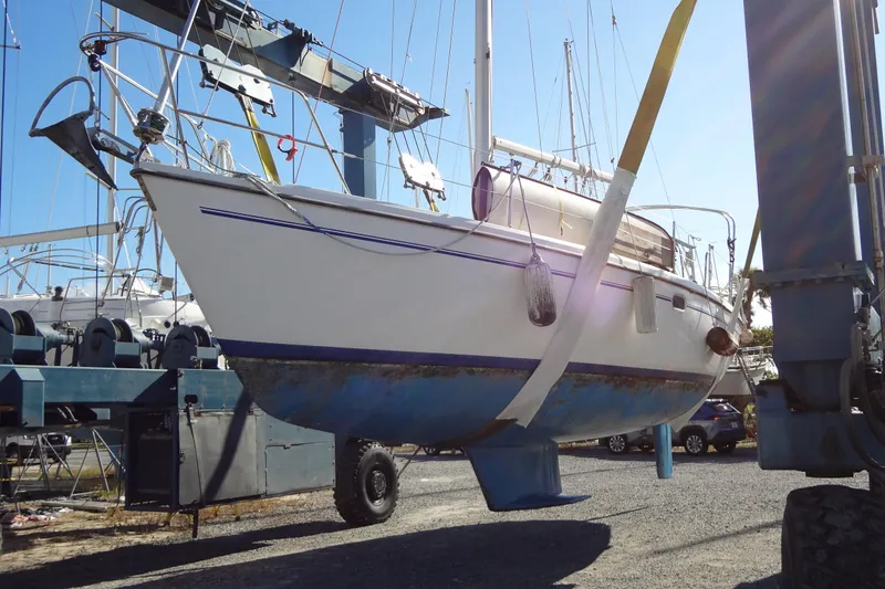 Slide: The Image of Catalina 36 MkII 2000 sailboat lifted in a boatyard for maintenance. - 15
