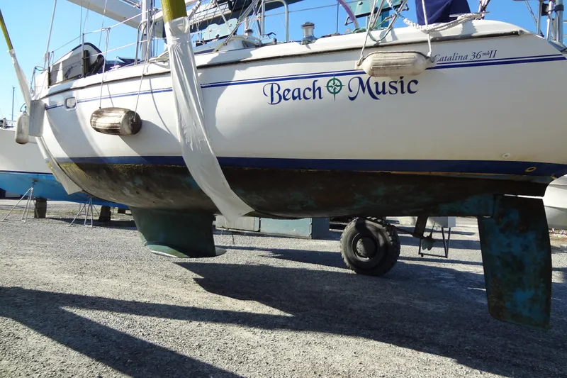 Slide: The Image of Catalina 36 MkII sailboat from 2000, named "Beach Music," on dry dock. - 16