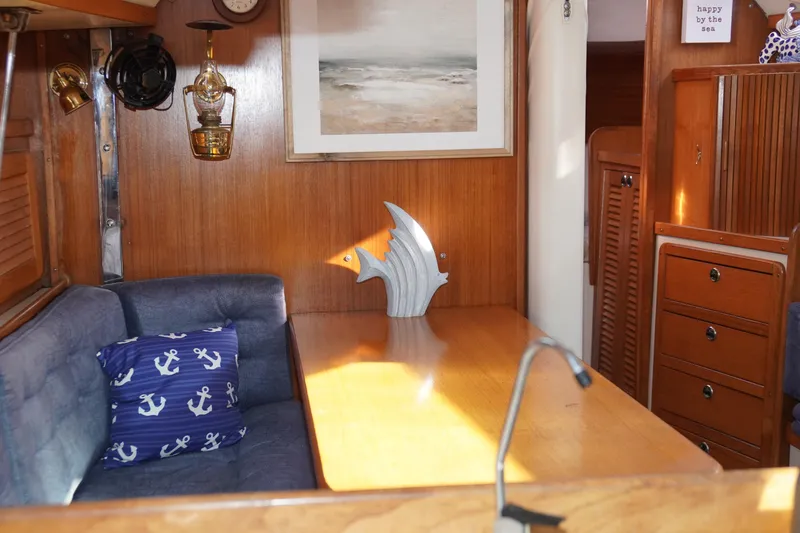 Slide: The Image of Cozy interior of 2000 Catalina 36 MkII sailboat with nautical decor and wooden furnishings. - 34