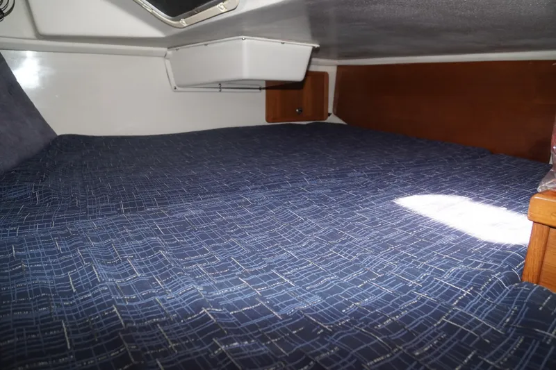 Slide: The Image of Interior cabin of 2000 Catalina 36 MkII sailboat with blue bedding. - 37