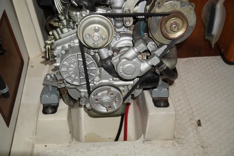 Slide: The Image of Engine compartment of a 2000 Catalina 36 MkII sailboat, showcasing mechanical components. - 39