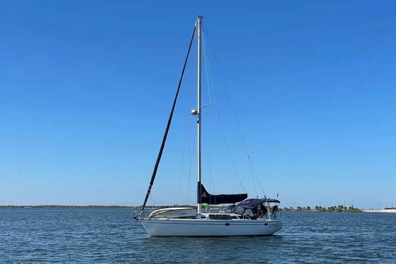 Slide: The Image of Sailboat Catalina 36 MkII 2000 on calm water under clear blue sky. - 44