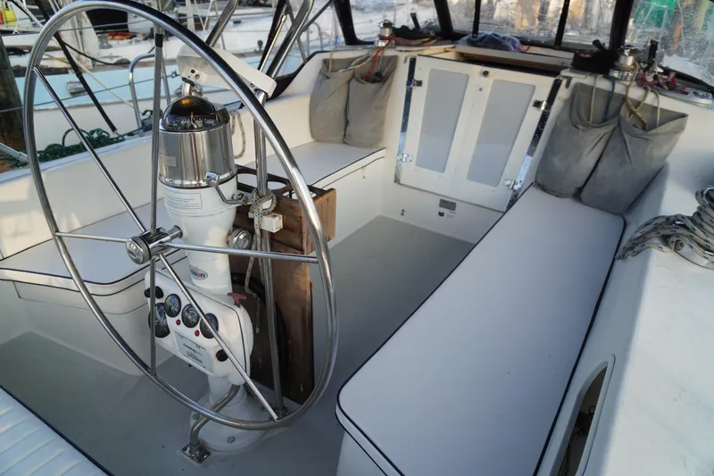 Slide: The Image of Cockpit of 2000 Catalina 36 MkII sailboat with steering wheel and seating. - 8