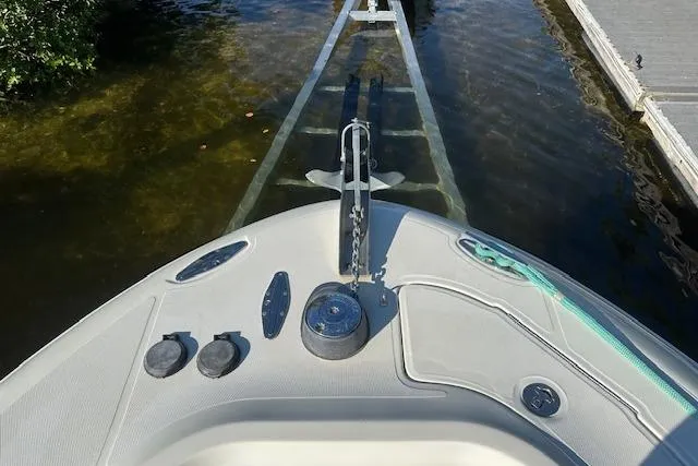 Slide: The Image of Bow view of 2007 Hydra-Sports Vector 3300 CC at dock, showing anchor and controls. - 12