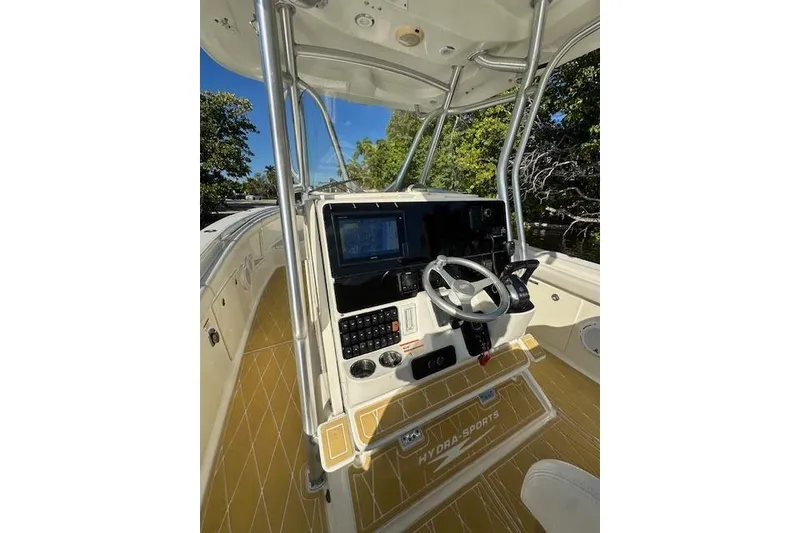 Slide: The Image of 2007 Hydra-Sports Vector 3300 CC boat console with steering wheel and navigation system. - 16