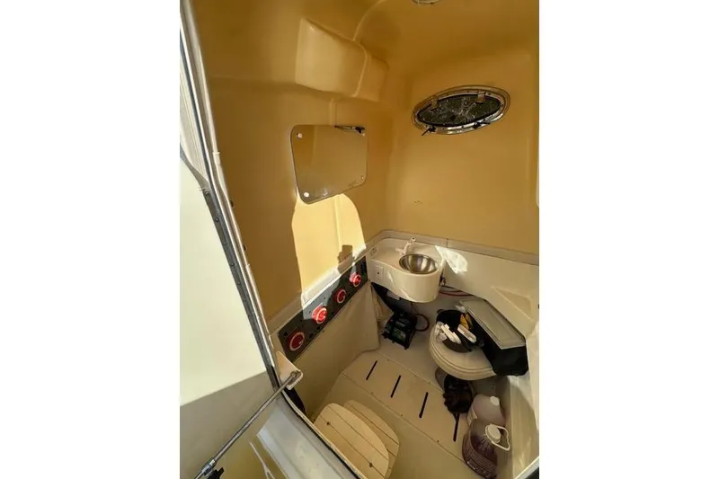 Slide: The Image of 2007 Hydra-Sports Vector 3300 CC cabin interior with sink and storage. - 17