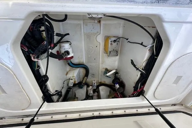 Slide: The Image of 2007 Hydra-Sports Vector 3300 CC boat compartment with wiring and components visible. - 18