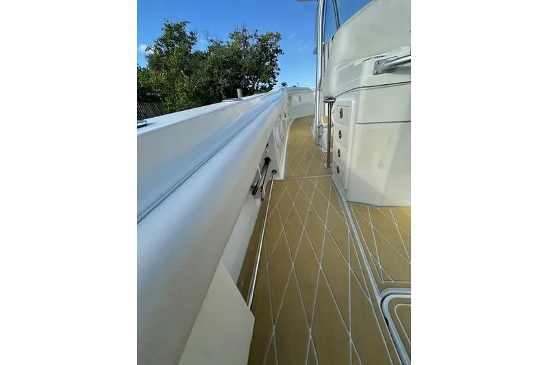 Slide: The Image of 2007 Hydra-Sports Vector 3300 CC boat deck with storage compartments and sleek design. - 21