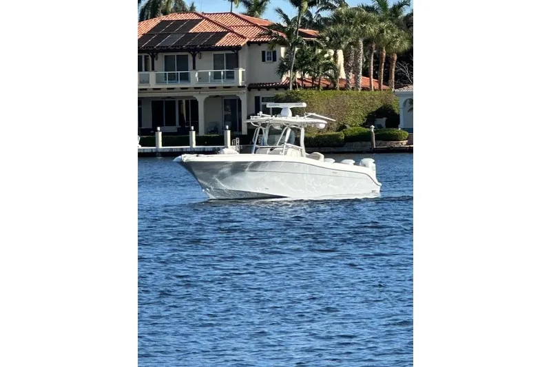 Slide: The Image of 2007 Hydra-Sports Vector 3300 CC boat on water near waterfront home. - 22