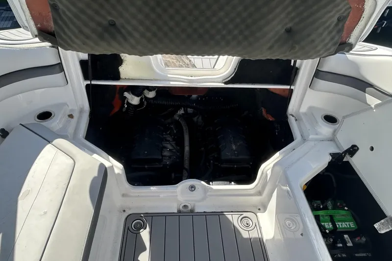 Slide: The Image of 2019 Yamaha AR-240 boat engine compartment with open hatch, revealing dual engines. - 22