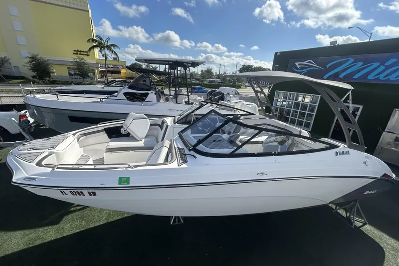 Slide: The Image of 2019 Yamaha AR-240 boat displayed outdoors under a sunny sky. - 9
