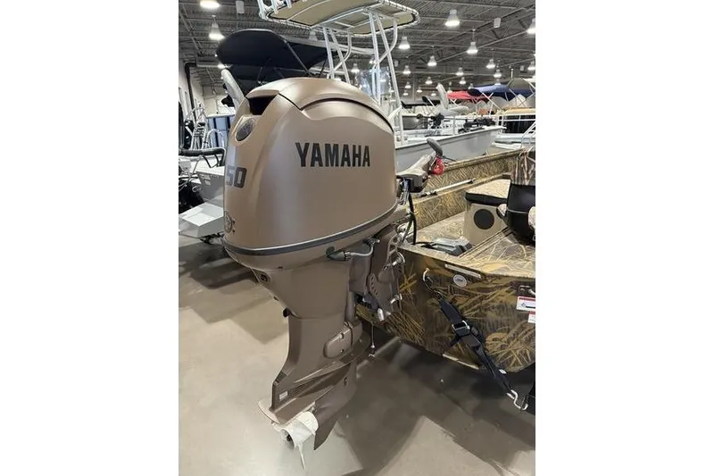 Slide: The Image of 2026 G3 Gator Tough 16 FL with Yamaha outboard motor in showroom. - 2
