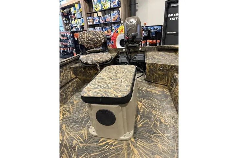 Slide: The Image of 2026 G3 Gator Tough 16 FL boat interior with camouflage seating and motor display. - 4