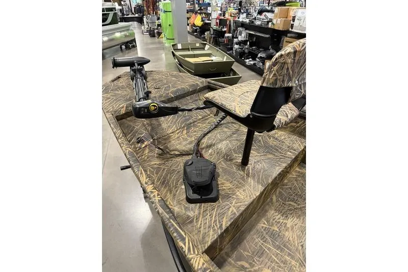 Slide: The Image of 2026 G3 Gator Tough 16 FL boat with camo seating and trolling motor. - 5