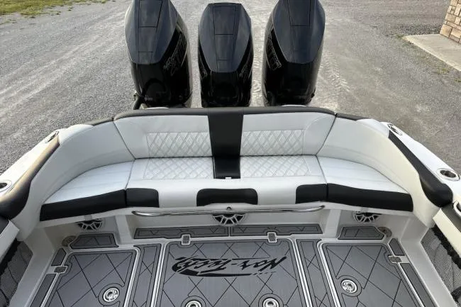 Slide: The Image of 2024 Nor-Tech 340 Sport Center Console with triple engines and luxurious seating. - 14