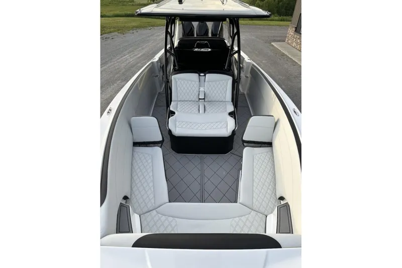 Slide: The Image of 2024 Nor-Tech 340 Sport Center Console with luxurious seating and sleek design. - 6
