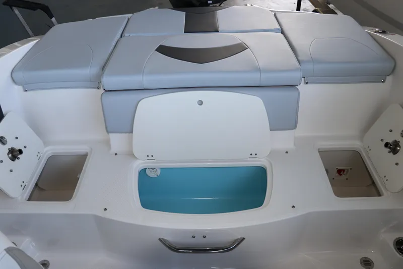 Slide: The Image of 2026 Chaparral 21 SSi Ski & Fish OB boat interior with storage compartments and seating. - 13