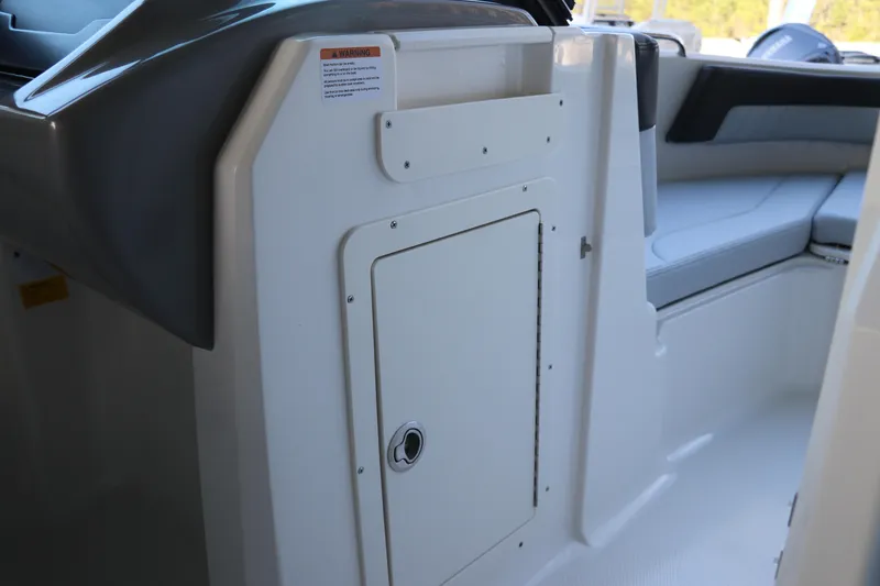 Slide: The Image of 2026 Chaparral 21 SSi Ski & Fish OB interior seating and storage compartment. - 22