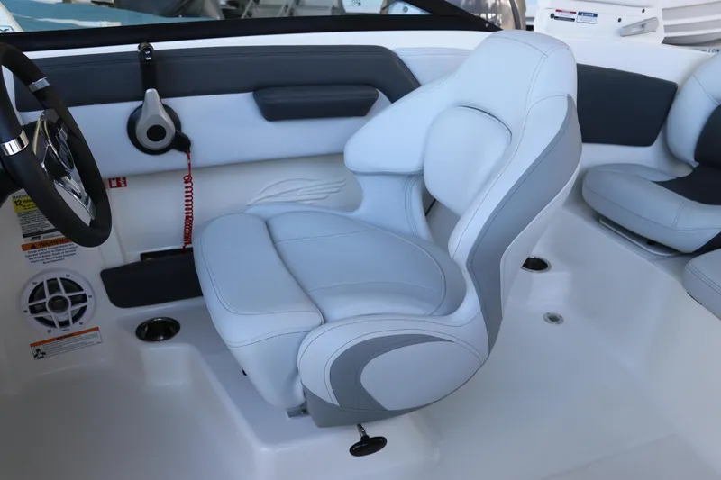 Slide: The Image of 2026 Chaparral 21 SSi Ski & Fish OB boat interior with sleek seating and steering wheel. - 27