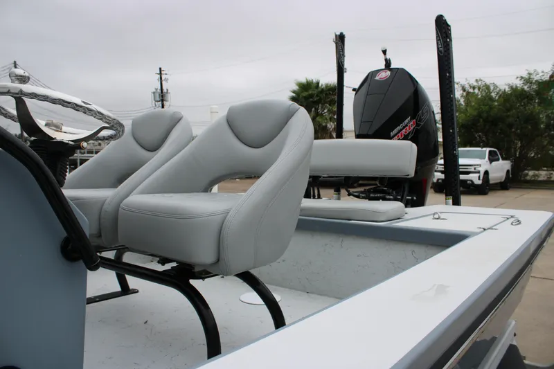 Slide: The Image of 2021 Blazer 2420 GTS boat interior with dual seats and Mercury engine. - 10