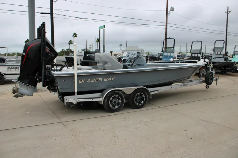 Slide: The Image of 2021 Blazer 2420 GTS boat on trailer, parked outdoors, side view. - 5