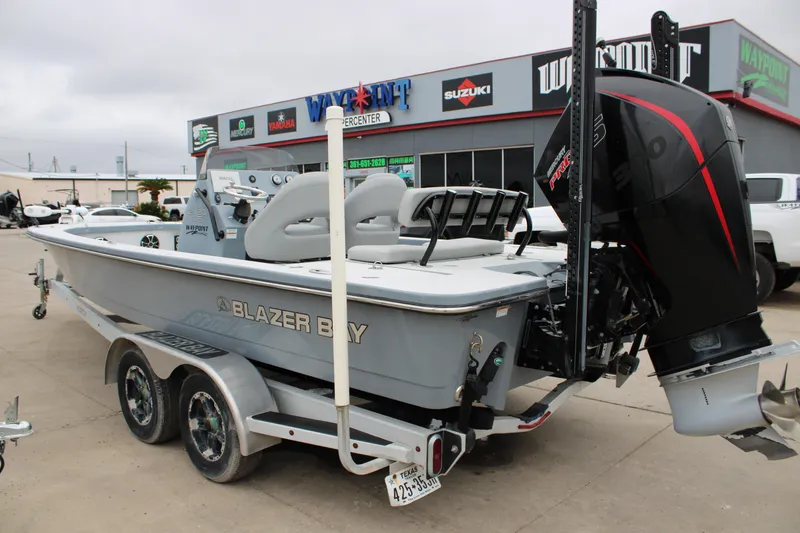 Slide: The Image of 2021 Blazer 2420 GTS boat with outboard motor at dealership. - 7
