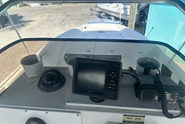 Slide: The Image of 1999 Mako Pro Skiff 21 CC boat dashboard with navigation equipment and controls. - 12