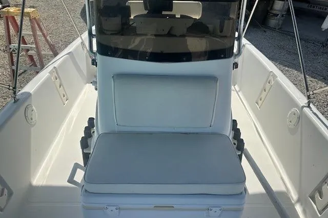 Slide: The Image of 1999 Mako Pro Skiff 21 CC boat interior with seating and console. - 5