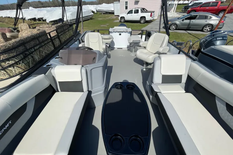 Slide: The Image of 2026 Starcraft VX 20 FD boat interior with seating and cup holders. - 11