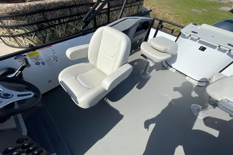 Slide: The Image of Interior of 2026 Starcraft VX 20 FD boat with comfortable seating and steering wheel. - 19