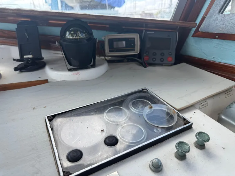 Slide: The Image of Control panel of a 1986 Cape Dory MS300 boat with navigation instruments. - 18
