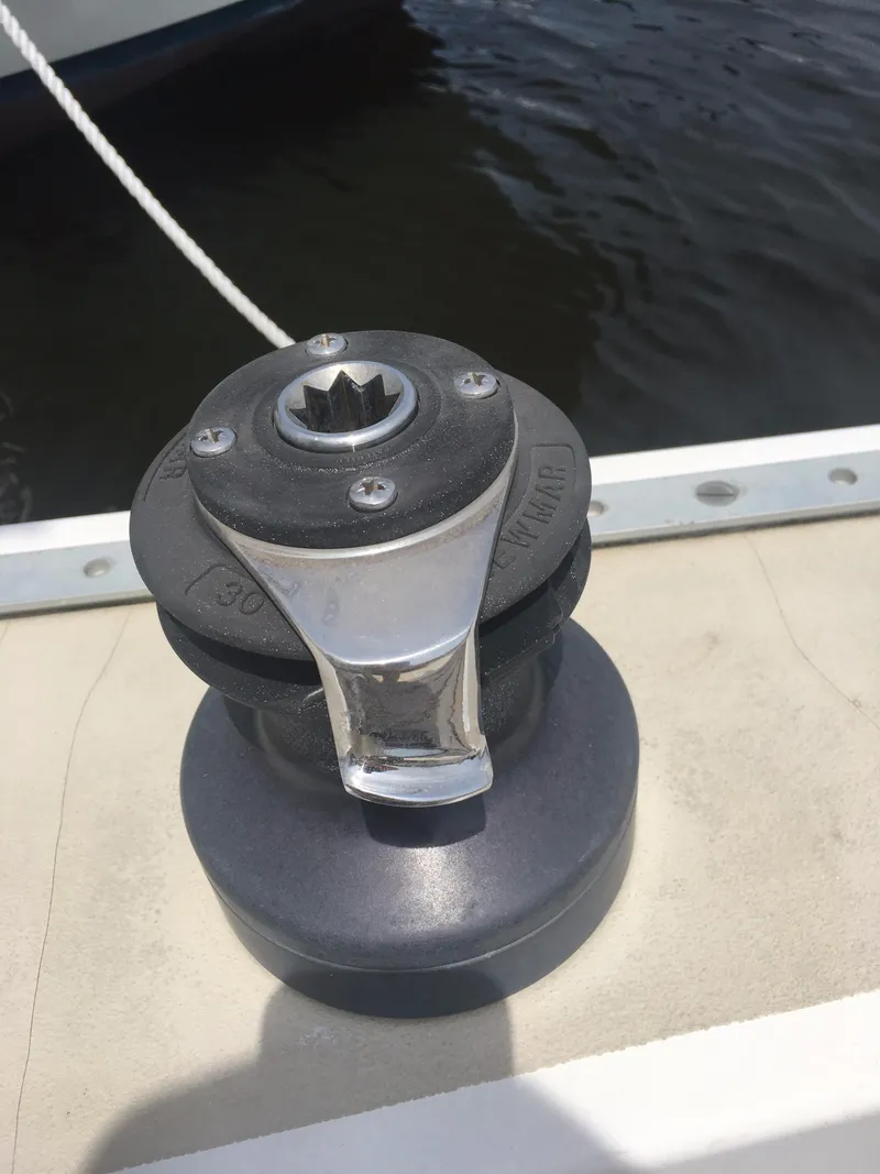 Slide: The Image of Winch on 1986 Cape Dory MS300 sailboat deck, near water. - 30