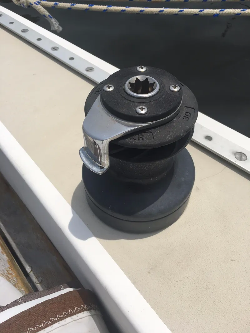 Slide: The Image of Winch on 1986 Cape Dory MS300 sailboat deck, with rope in background. - 31