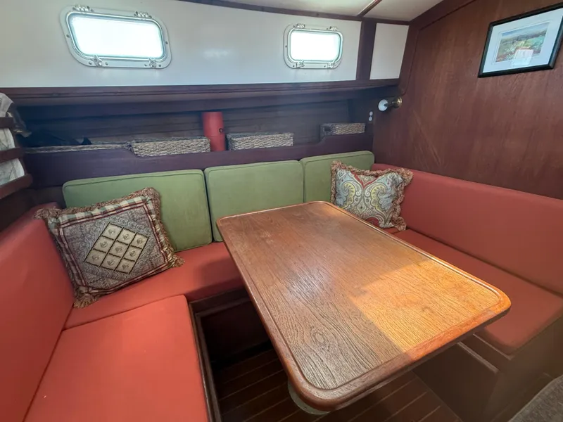Slide: The Image of Interior of 1986 Cape Dory MS300 sailboat with cozy seating and wooden table. - 37