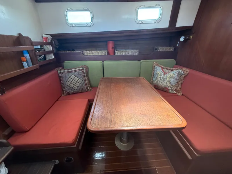 Slide: The Image of Interior of 1986 Cape Dory MS300 sailboat with red seating and wooden table. - 38