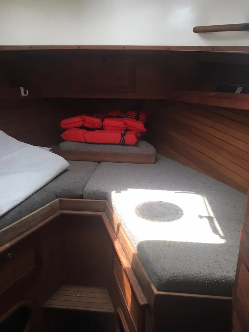 Slide: The Image of Cozy cabin interior of 1986 Cape Dory MS300 with cushions and life jackets. - 42
