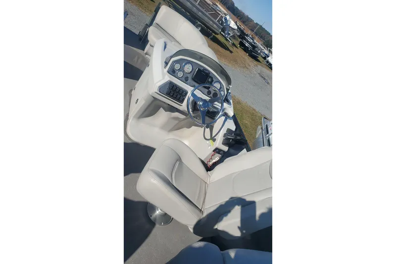Slide: The Image of 2018 Starcraft SLS 3 boat interior with steering wheel and control panel. - 10