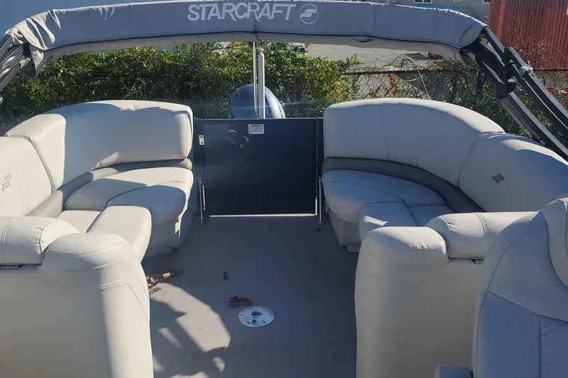 Slide: The Image of 2018 Starcraft SLS 3 pontoon boat with spacious seating and canopy. - 12