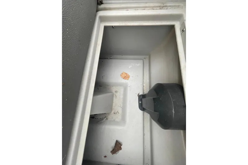 Slide: The Image of Interior compartment of a 2018 Starcraft SLS 3 boat, showing storage space. - 17