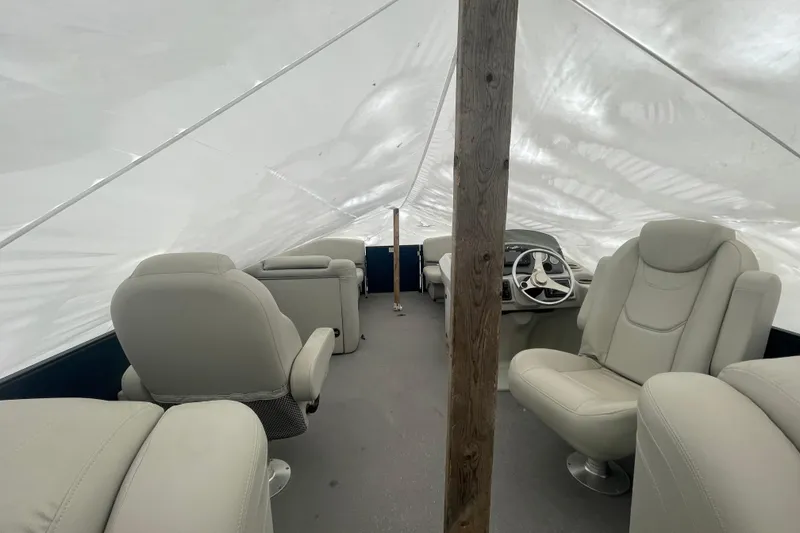 Slide: The Image of Interior of a 2018 Starcraft SLS 3 boat with covered seating area. - 18