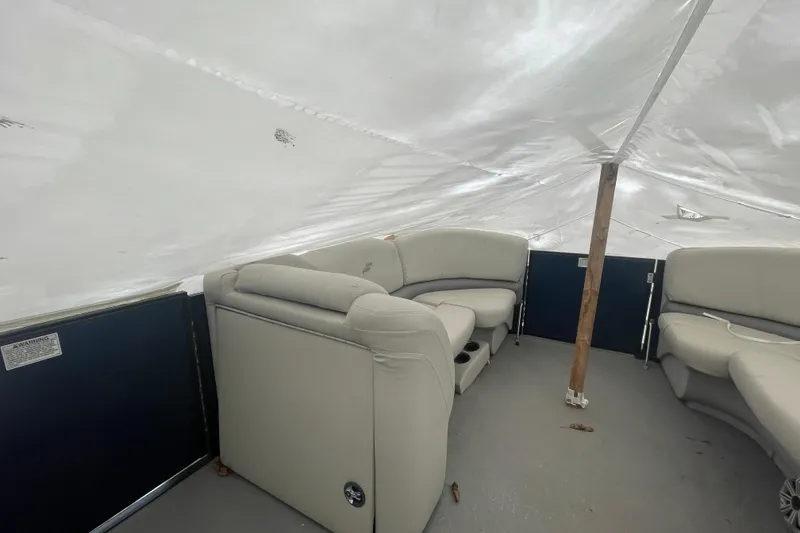 Slide: The Image of Interior of a 2018 Starcraft SLS 3 boat with covered seating area. - 20