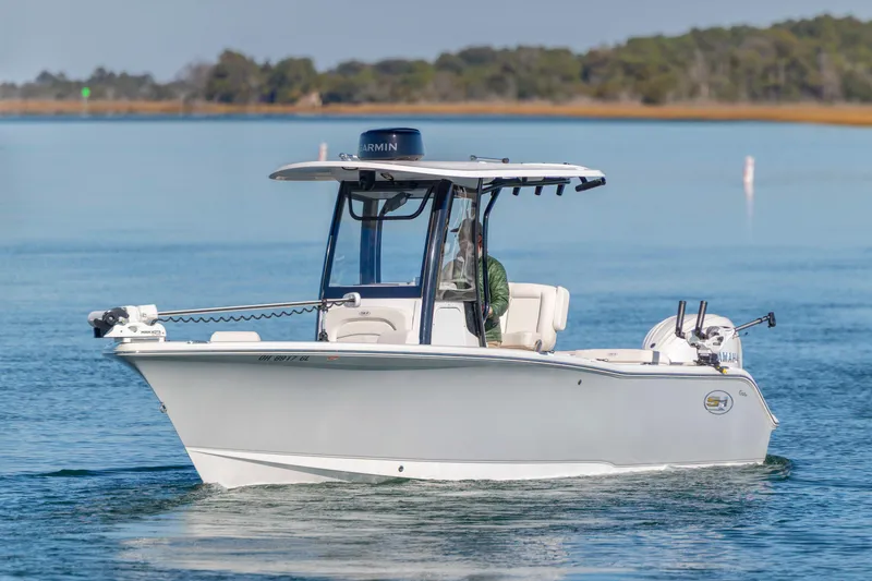 The Image of 2024 Sea Hunt Ultra 239 SE boat cruising on calm waters. - 0